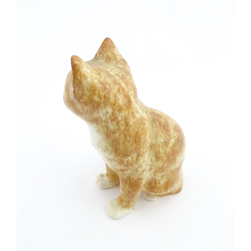 138 - A Winstanley model of a seated ginger cat. Marked under and numbered 26. Approx. 9