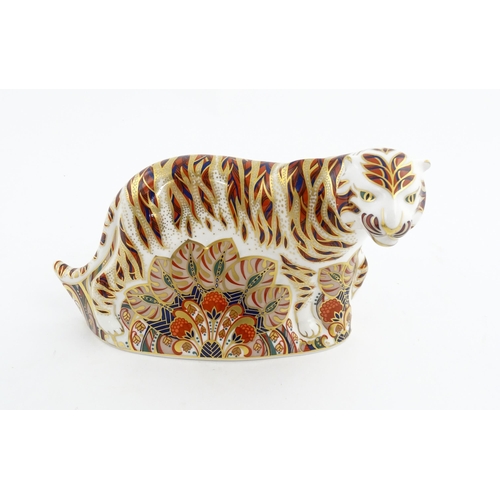 139 - A Royal Crown Derby paperweight modelled as a Bengal Tiger. Marked under. Approx. 5 1/4