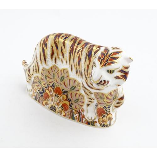 139 - A Royal Crown Derby paperweight modelled as a Bengal Tiger. Marked under. Approx. 5 1/4