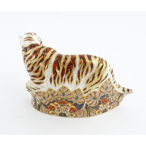 139 - A Royal Crown Derby paperweight modelled as a Bengal Tiger. Marked under. Approx. 5 1/4