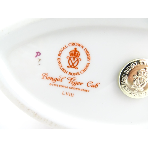 140 - A Royal Crown Derby paperweight modelled as a Bengal Tiger Cub. Marked under. Approx. 4