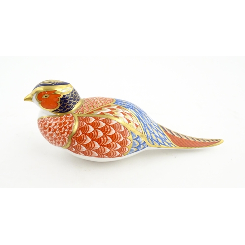 141 - A Royal Crown Derby paperweight modelled as a Pheasant. Marked under. Approx. 6 3/4