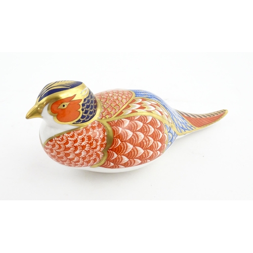 141 - A Royal Crown Derby paperweight modelled as a Pheasant. Marked under. Approx. 6 3/4