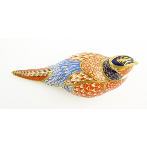 141 - A Royal Crown Derby paperweight modelled as a Pheasant. Marked under. Approx. 6 3/4