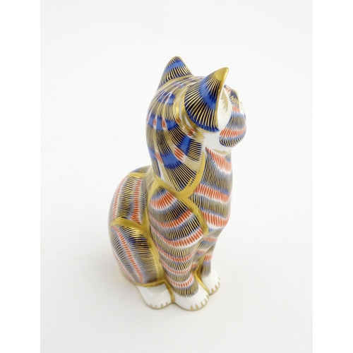 143 - A Royal Crown Derby paperweight modelled as a seated cat. Marked under. Approx. 5