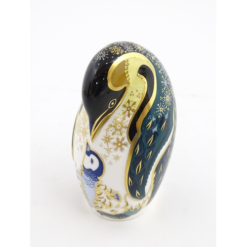 146 - A Royal Crown Derby paperweight modelled as a penguin and chick. Marked under. Approx. 5