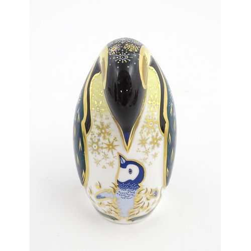 146 - A Royal Crown Derby paperweight modelled as a penguin and chick. Marked under. Approx. 5