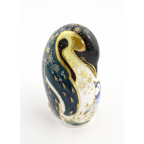 146 - A Royal Crown Derby paperweight modelled as a penguin and chick. Marked under. Approx. 5