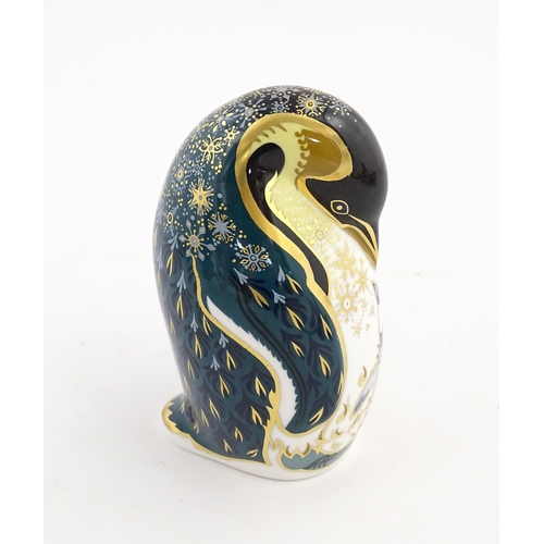 146 - A Royal Crown Derby paperweight modelled as a penguin and chick. Marked under. Approx. 5