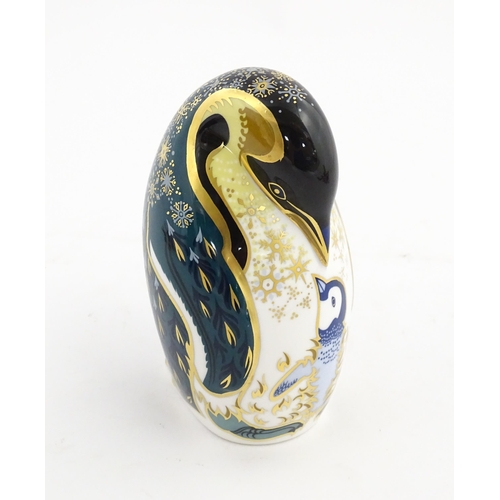 146 - A Royal Crown Derby paperweight modelled as a penguin and chick. Marked under. Approx. 5