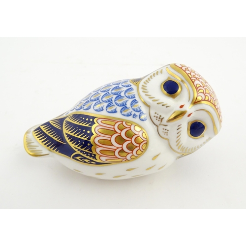 147 - A Royal Crown Derby paperweight modelled as an owl. Marked under. Approx. 3