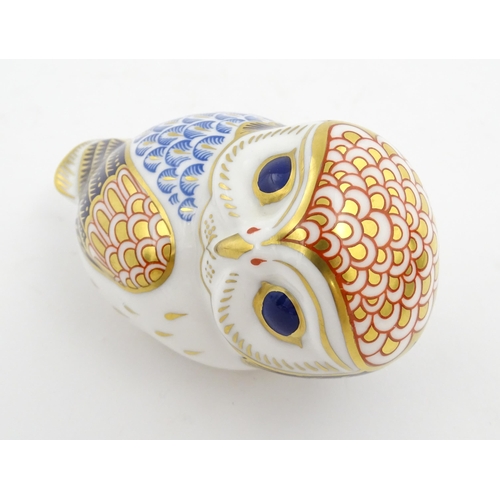 147 - A Royal Crown Derby paperweight modelled as an owl. Marked under. Approx. 3