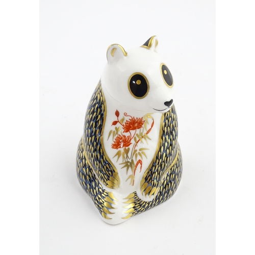 148 - A Royal Crown Derby paperweight modelled as a panda. Marked under. Approx. 4