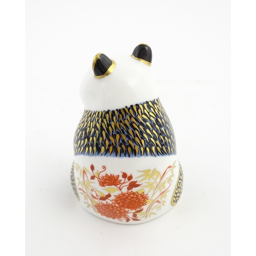 148 - A Royal Crown Derby paperweight modelled as a panda. Marked under. Approx. 4