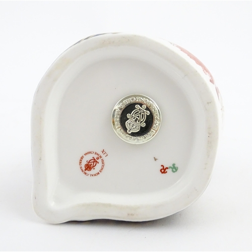 148 - A Royal Crown Derby paperweight modelled as a panda. Marked under. Approx. 4