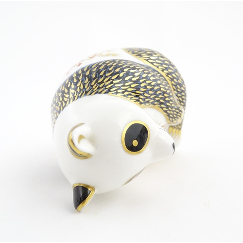 148 - A Royal Crown Derby paperweight modelled as a panda. Marked under. Approx. 4