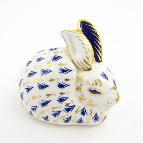 149 - A Royal Crown Derby paperweight modelled as a rabbit. Marked under. Approx. 3