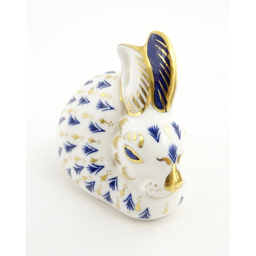 149 - A Royal Crown Derby paperweight modelled as a rabbit. Marked under. Approx. 3