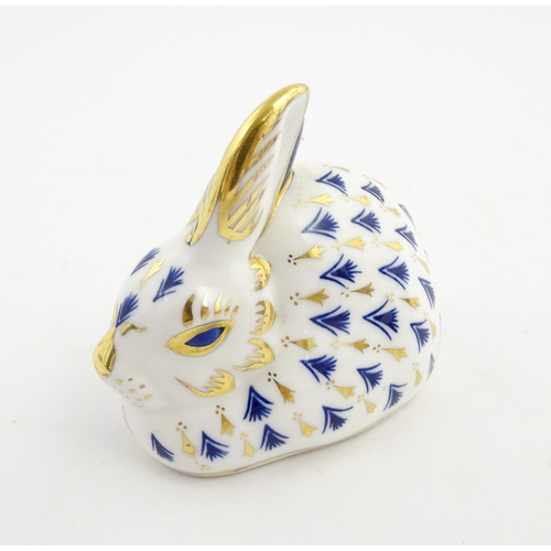 149 - A Royal Crown Derby paperweight modelled as a rabbit. Marked under. Approx. 3