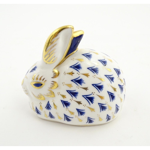 149 - A Royal Crown Derby paperweight modelled as a rabbit. Marked under. Approx. 3