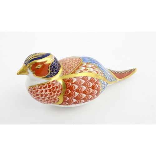 150 - A Royal Crown Derby paperweight modelled as a pheasant. Marked under. Approx. 6 3/4