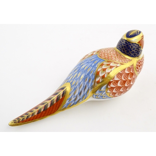 150 - A Royal Crown Derby paperweight modelled as a pheasant. Marked under. Approx. 6 3/4