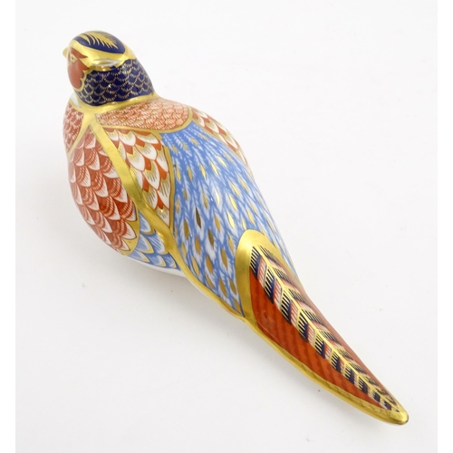 150 - A Royal Crown Derby paperweight modelled as a pheasant. Marked under. Approx. 6 3/4