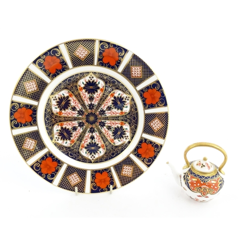 151 - A Royal Crown Derby plate and a miniature teapot decorated in the Imari palette. Marked under. Teapo... 