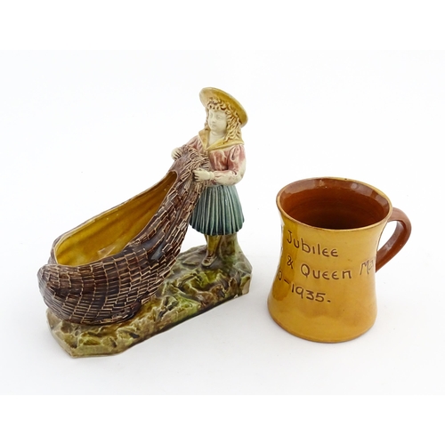 154 - A Victorian Torquay majolica pottery table salt modelled as a fisher girl with a net. Marked under W... 