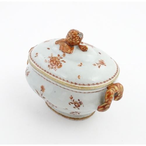 156 - Two items of porcelain decorated with orange flowers on a white ground, comprising a lidded sugar bo... 