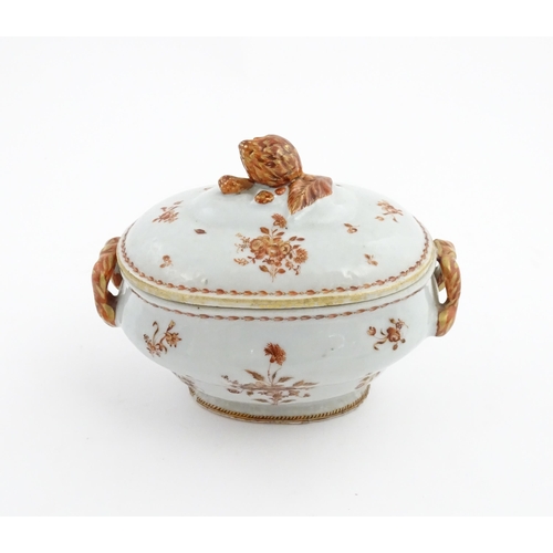 156 - Two items of porcelain decorated with orange flowers on a white ground, comprising a lidded sugar bo... 