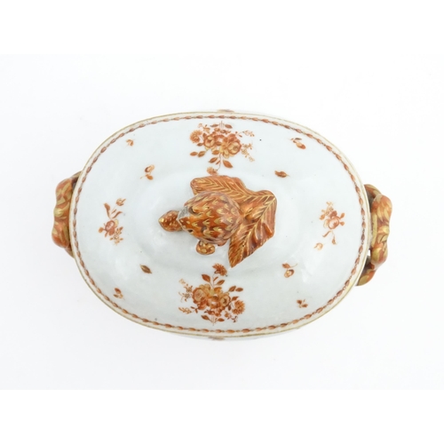 156 - Two items of porcelain decorated with orange flowers on a white ground, comprising a lidded sugar bo... 