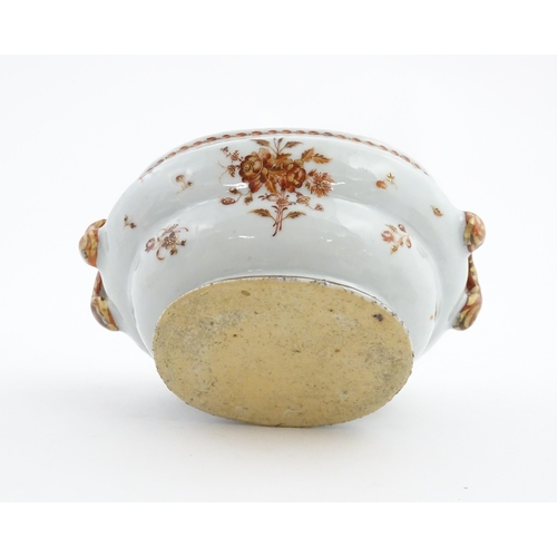 156 - Two items of porcelain decorated with orange flowers on a white ground, comprising a lidded sugar bo... 