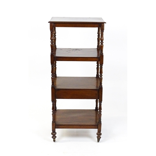 1558 - A 19thC mahogany four tier whatnot with the top tier having an adjustable tilt top, the tiers raised... 