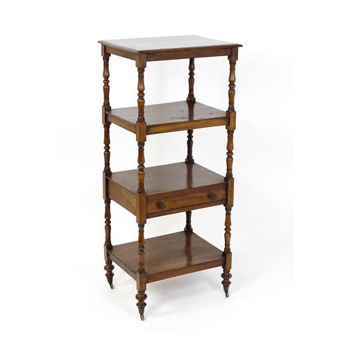 1558 - A 19thC mahogany four tier whatnot with the top tier having an adjustable tilt top, the tiers raised... 