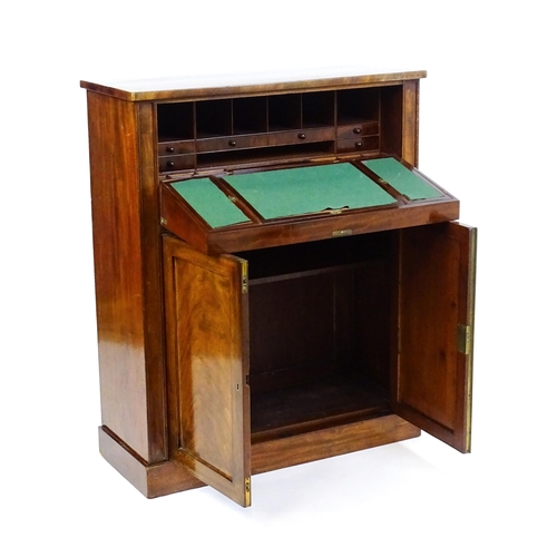 1641 - A 19thC mahogany secretaire with a fall front opening to show a fitted interior with pigeon holes, s... 