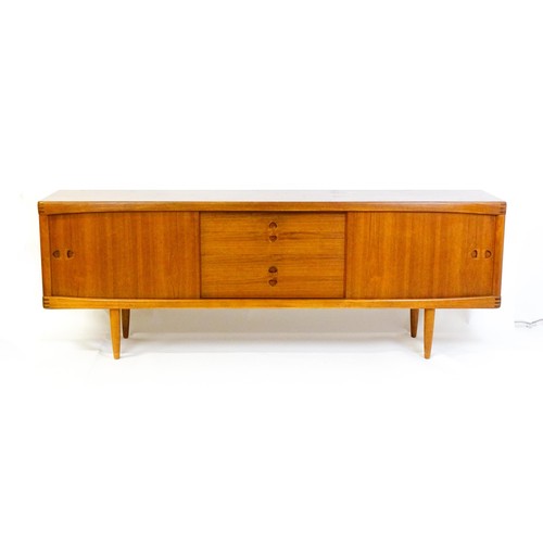 1648 - Vintage / Retro: A Danish teak sideboard designed by H.W.Klein for Bramin. With a bank of four drawe... 