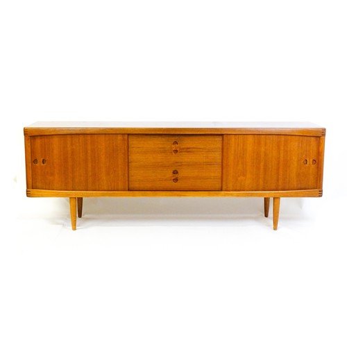 1648 - Vintage / Retro: A Danish teak sideboard designed by H.W.Klein for Bramin. With a bank of four drawe... 