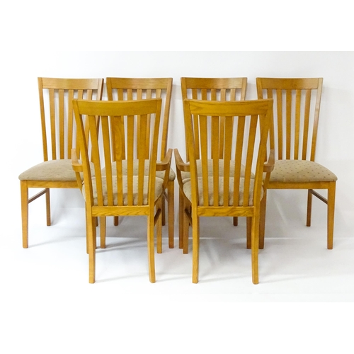 1654 - A set of six G-plan dining chairs with fanned, slatted backrests raised on four tapering straight le... 