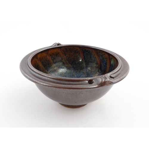 180 - A John Harlow studio pottery bowl with handle detail to rim. Stamped under John Harlow Somerset. App... 