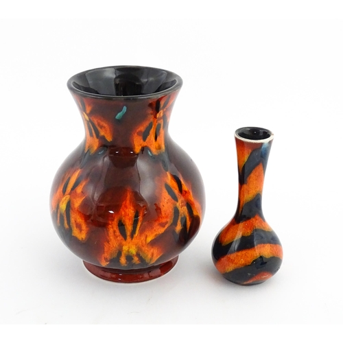 184 - Two Anita Harris Studio pottery vases with orange grounds and black detail. Both with artist initial... 