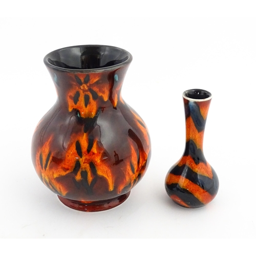 184 - Two Anita Harris Studio pottery vases with orange grounds and black detail. Both with artist initial... 