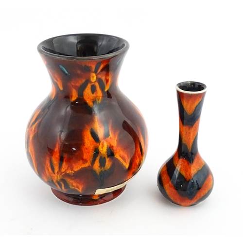 184 - Two Anita Harris Studio pottery vases with orange grounds and black detail. Both with artist initial... 