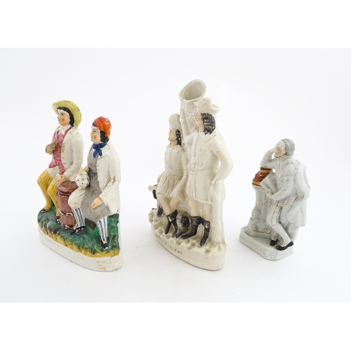 196 - Three Staffordshire figures / figural groups comprising Robin Hood, Shakespeare and Tam O' Shanter a... 