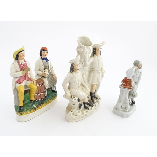 196 - Three Staffordshire figures / figural groups comprising Robin Hood, Shakespeare and Tam O' Shanter a... 