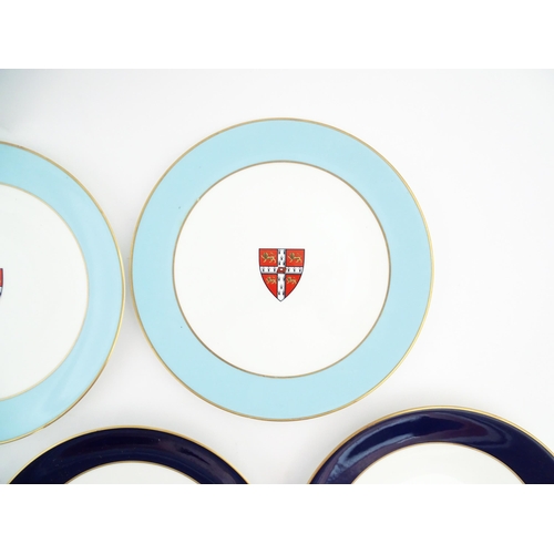 198 - Seven Royal Worcester armorial plates to include two bearing the Cambridge University coat of arms, ... 