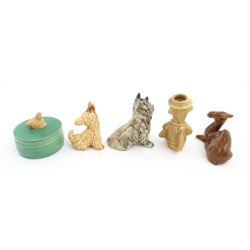 202 - Five Sylvac animal items to include a cairn terrier, seated dog, dog with a tennis racket, a camel a... 