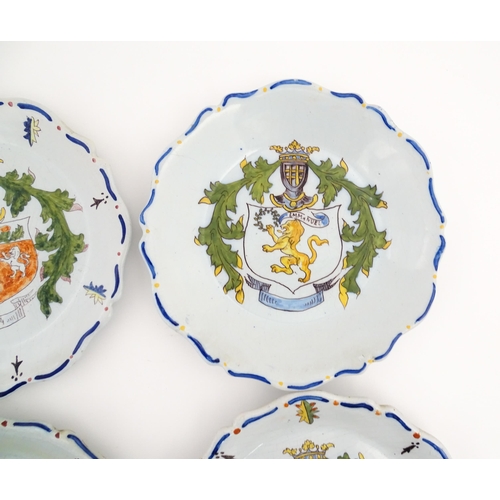 209 - Four Continental faience plates each decorated with a hand painted armorial. Approx. 10