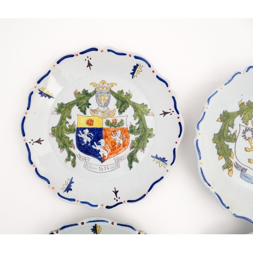 209 - Four Continental faience plates each decorated with a hand painted armorial. Approx. 10