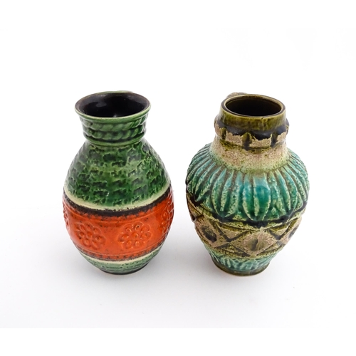 232 - Two West German Bay vases with single handle, one with a green glaze, tope twist detail and orange b... 